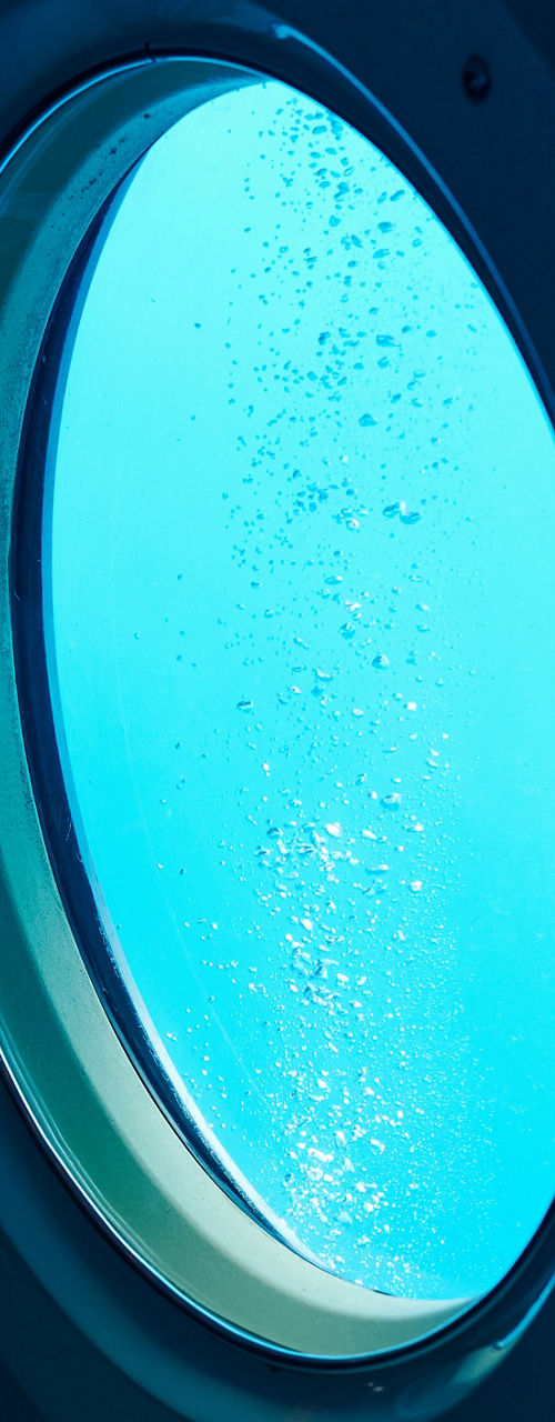 Underwater view through submarine portholes