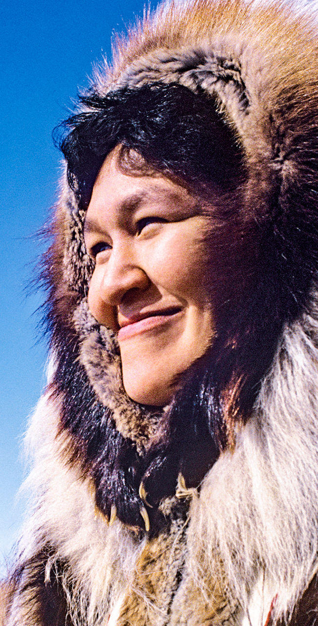 Person in fur-lined winter parka outdoors