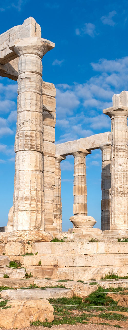 Ancient Temple of Poseidon under blue sky