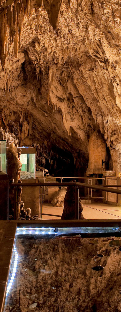 Illuminated cave interior with exhibit displays