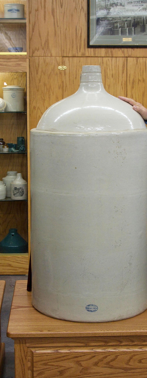 Large ceramic jugs in museum display