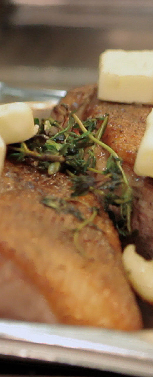 Seared meat with butter and herbs