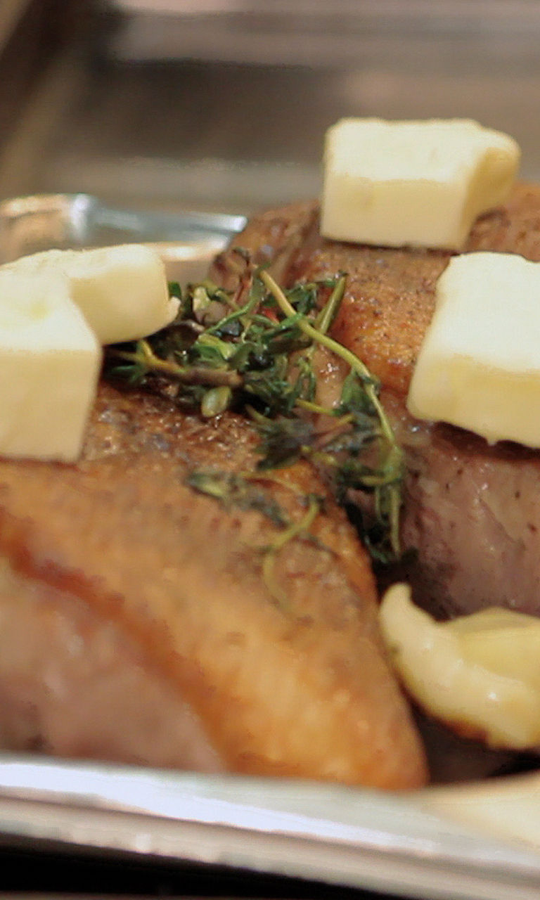 Seared meat with butter and herbs