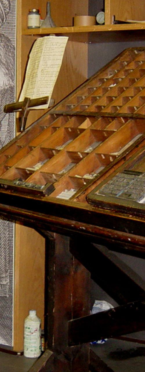 Vintage printing press in workshop setting