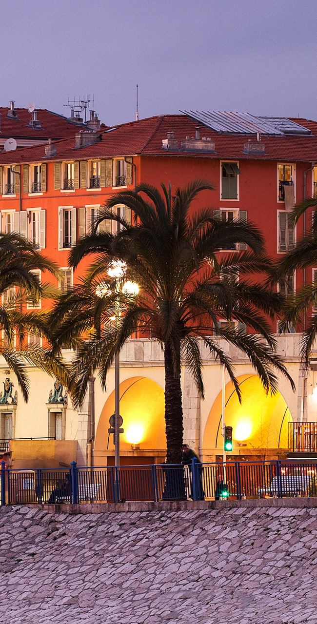 Coastal cityscape with illuminated buildings