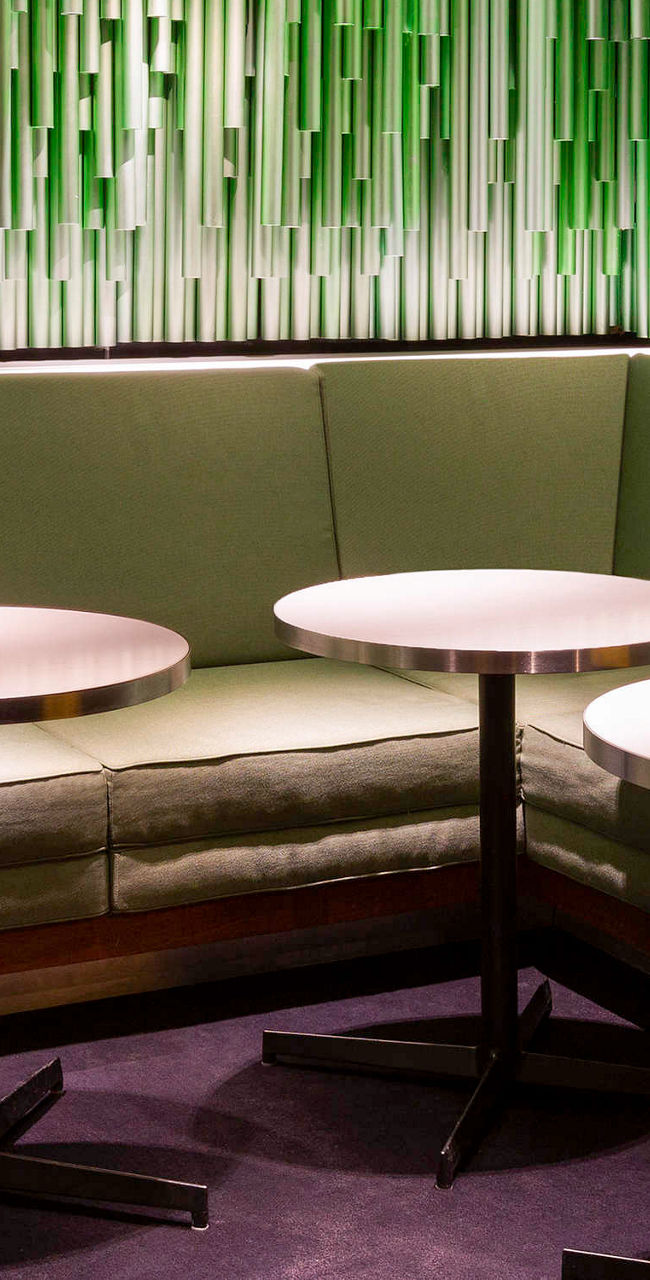 Modern lounge with green textured walls
