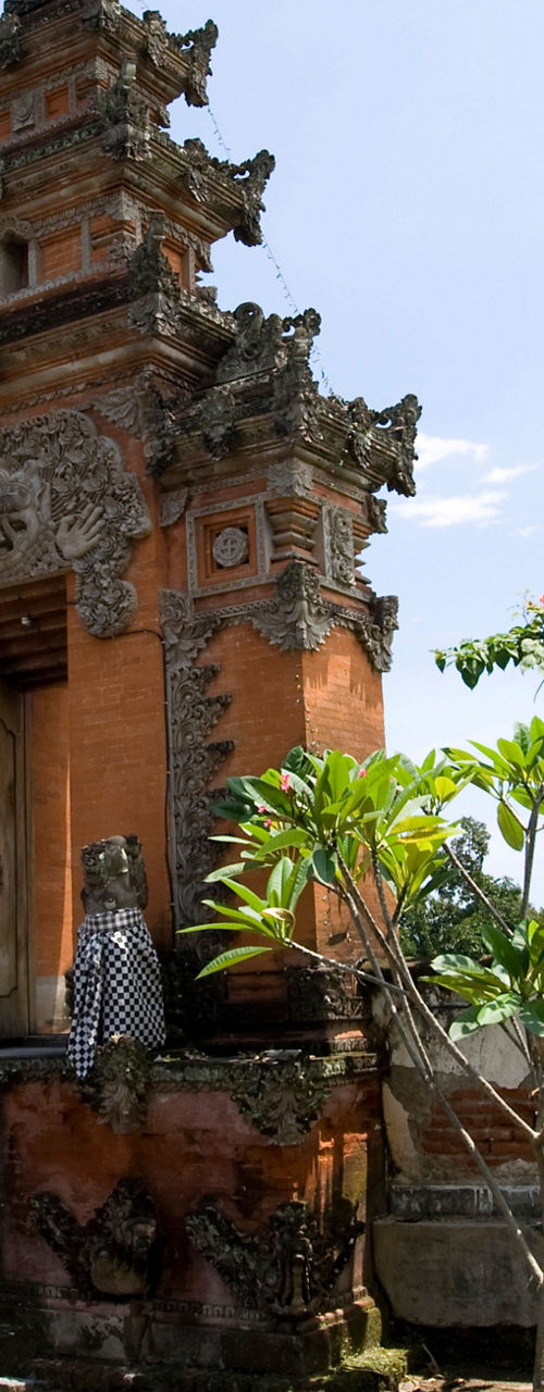 Traditional Balinese temple gate under clear sky