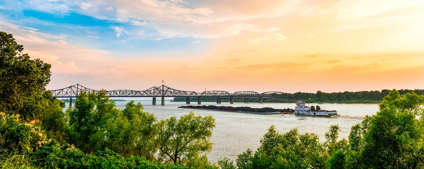 Scenic River View with Bridge at Sunset