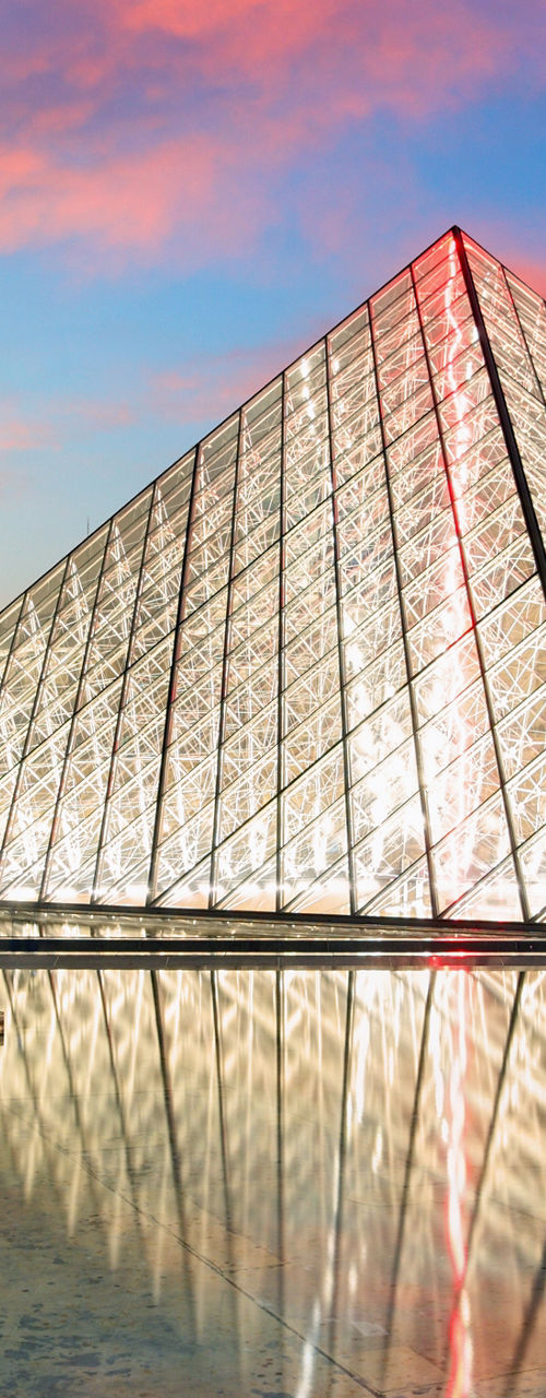 Louvre Pyramid at Sunset with Reflection