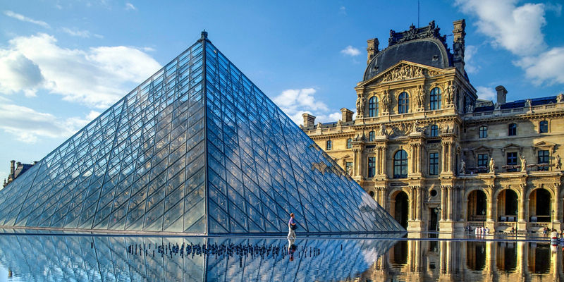 Louvre Pyramid with reflective water view