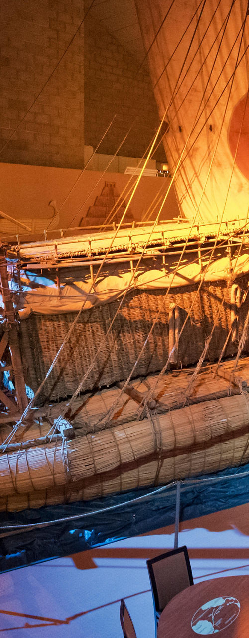 Traditional wooden sailing vessel in museum exhibit