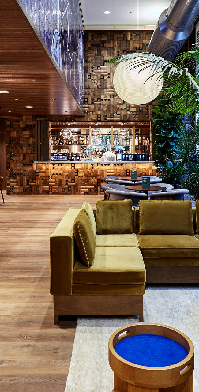 Modern lounge with cozy seating and bookshelves
