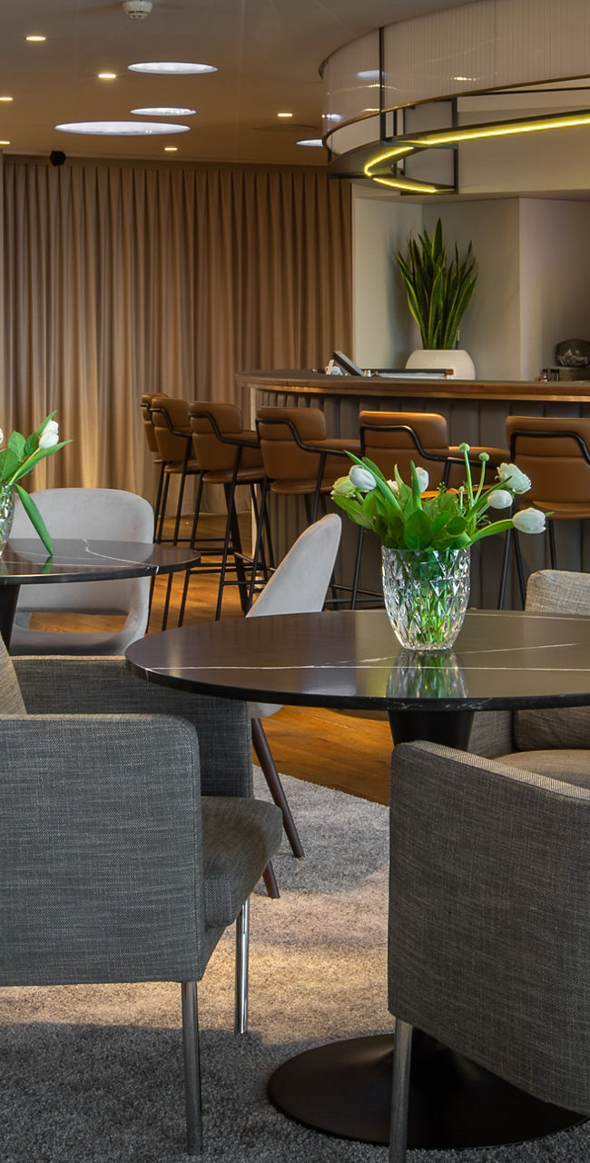 Modern lounge with bar and seating area