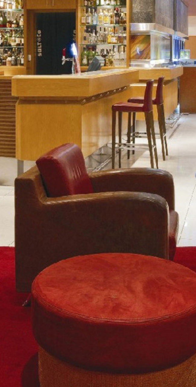 Modern hotel lounge with red seating