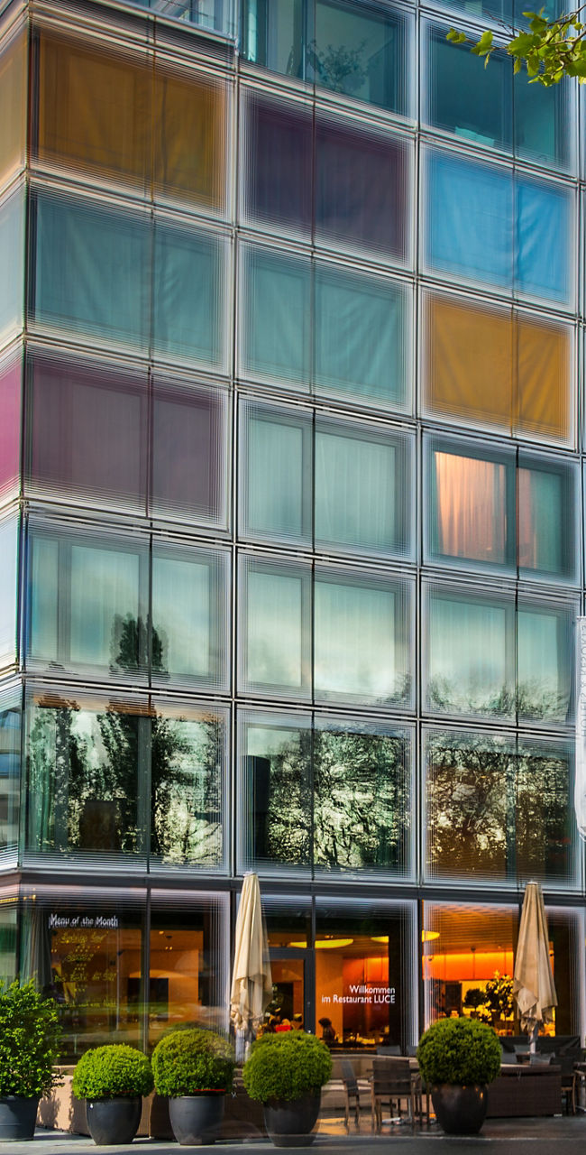 Modern glass building with colorful panels