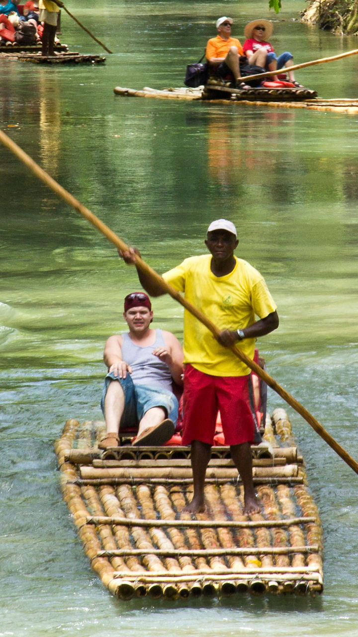 Bamboo rafting on tropical river