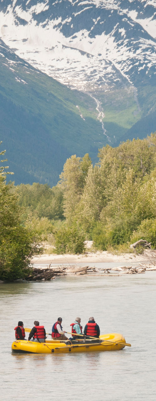 Group rafting on scenic mountain river