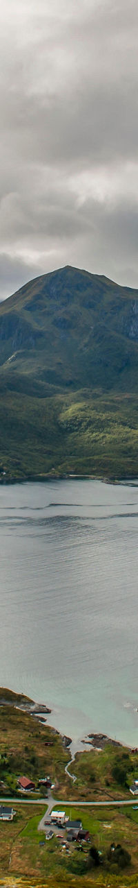 Scenic mountain island under cloudy sky