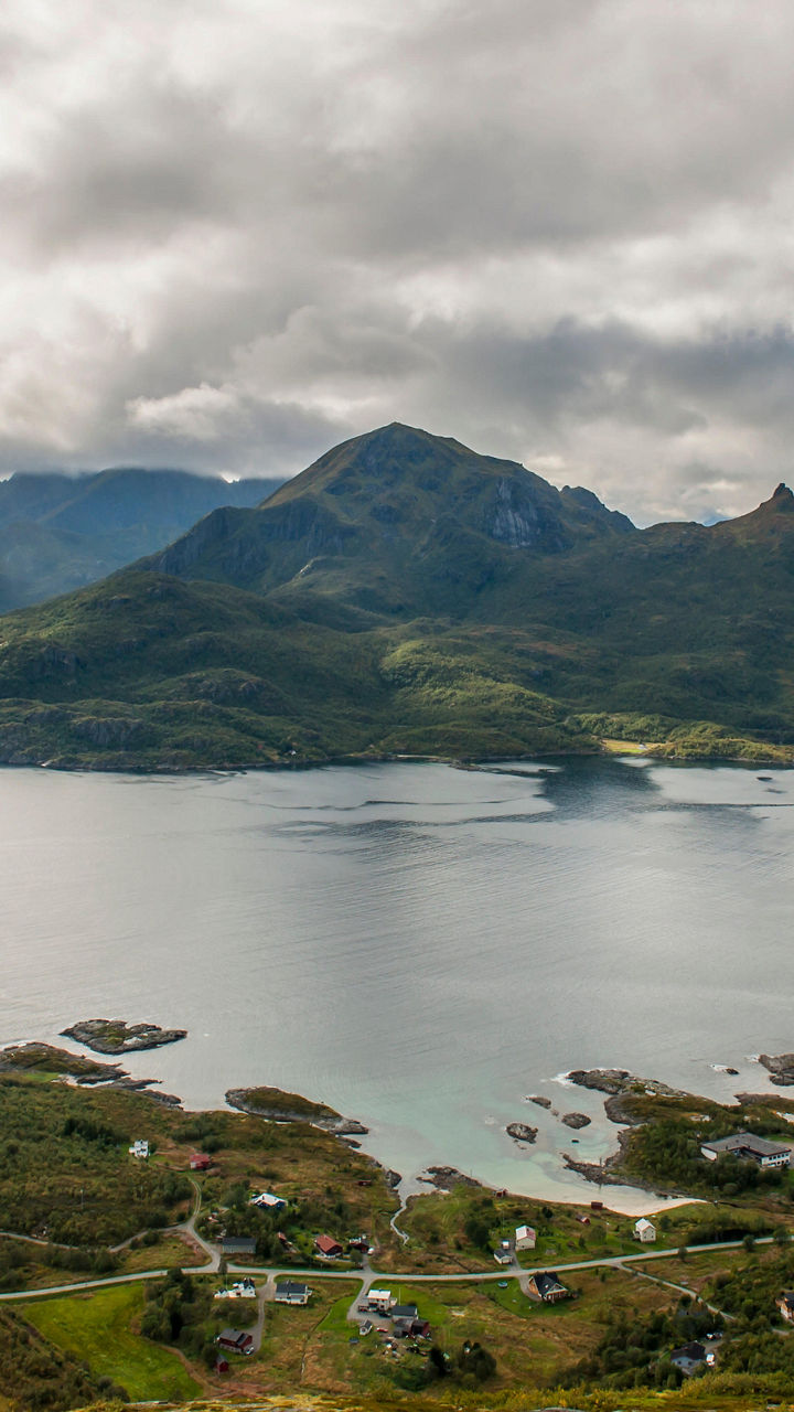 Scenic mountain island under cloudy sky