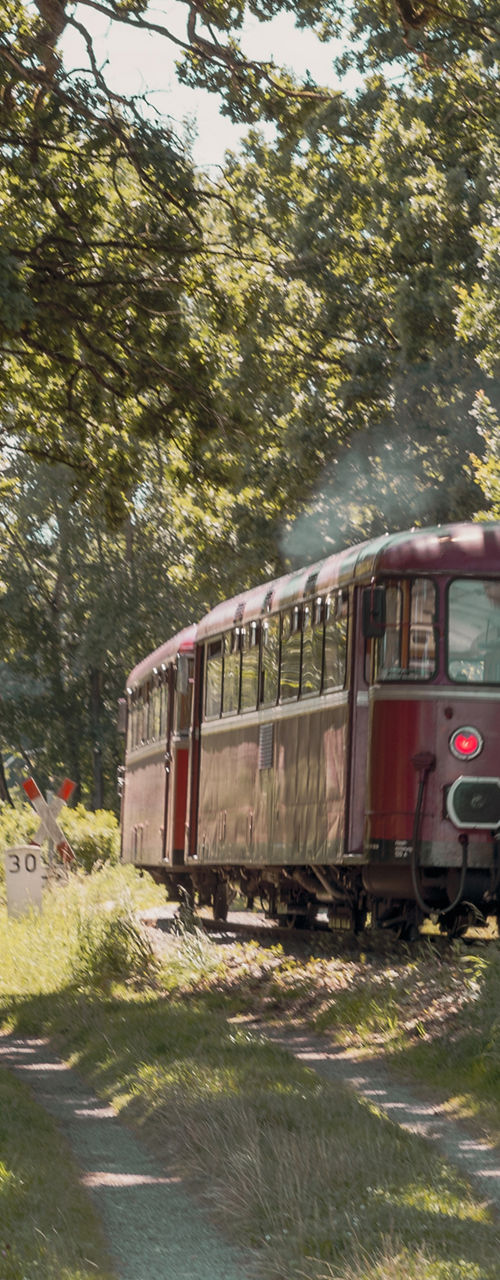 Vintage red train on rural path
