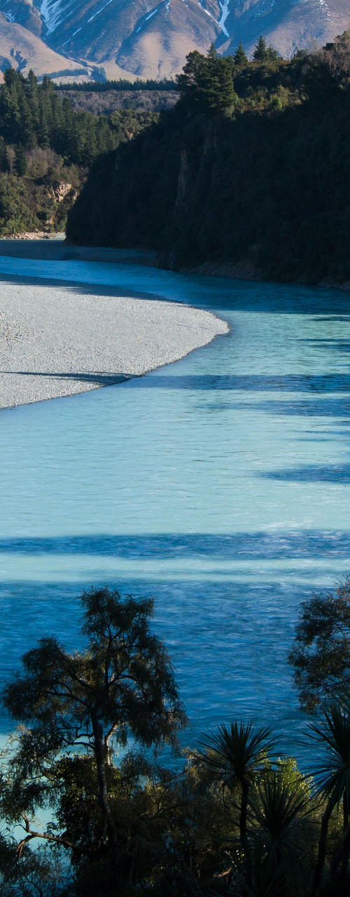Scenic river with snowy mountain backdrop