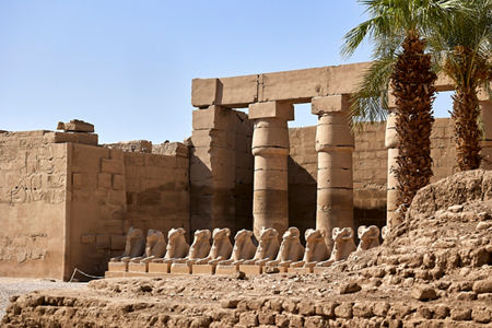 Ancient Egyptian temple ruins with statues