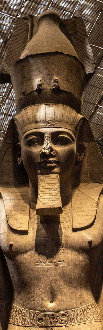 Colossal Ancient Egyptian Pharaoh Statue in Museum Atrium