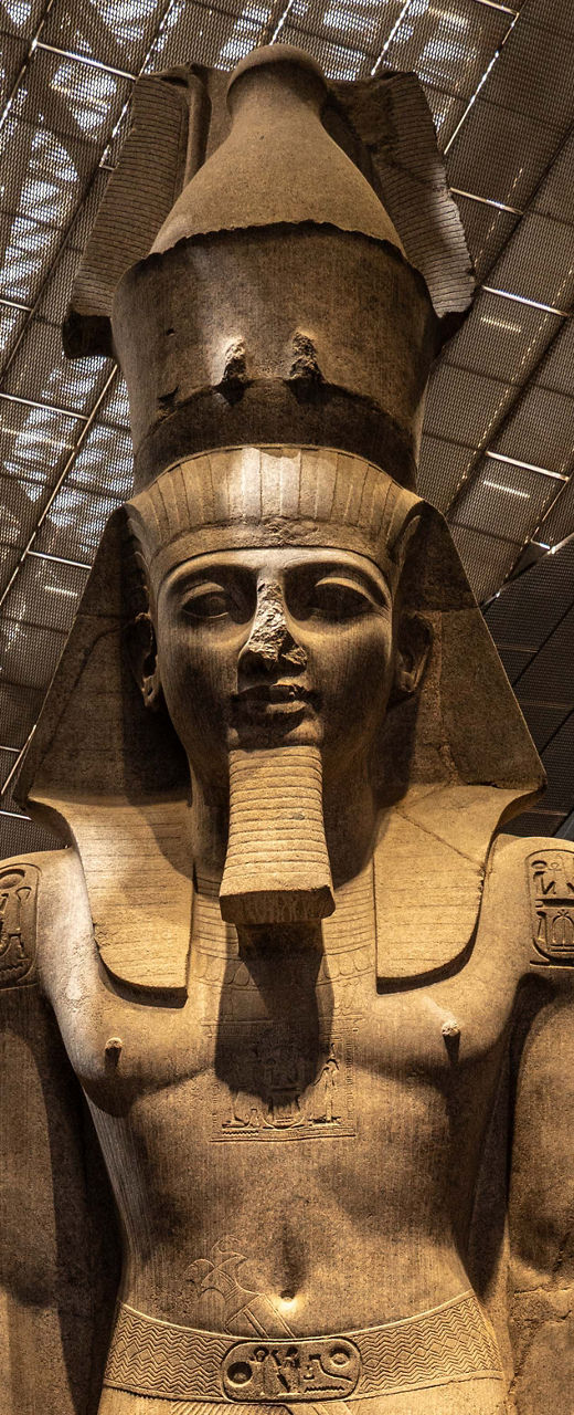 Colossal Ancient Egyptian Pharaoh Statue in Museum Atrium