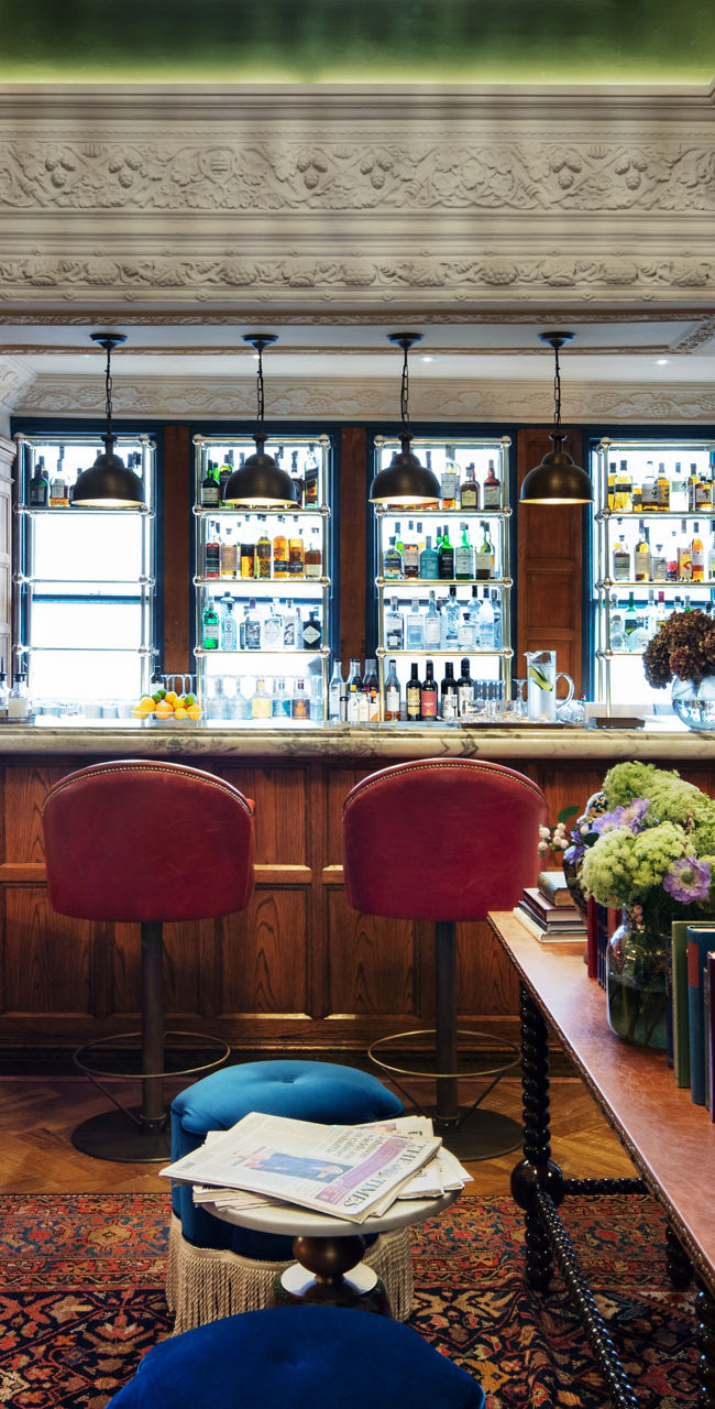 Elegant lounge bar with vaulted ceiling and vintage decor