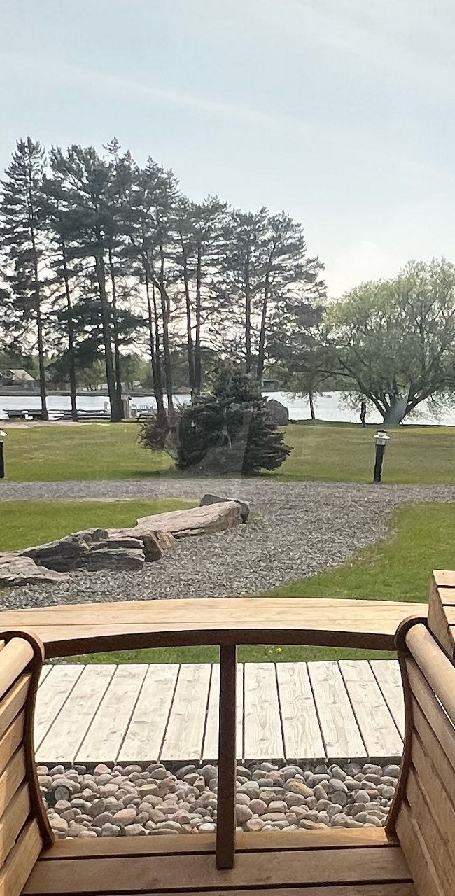 Wooden sauna with scenic lake view