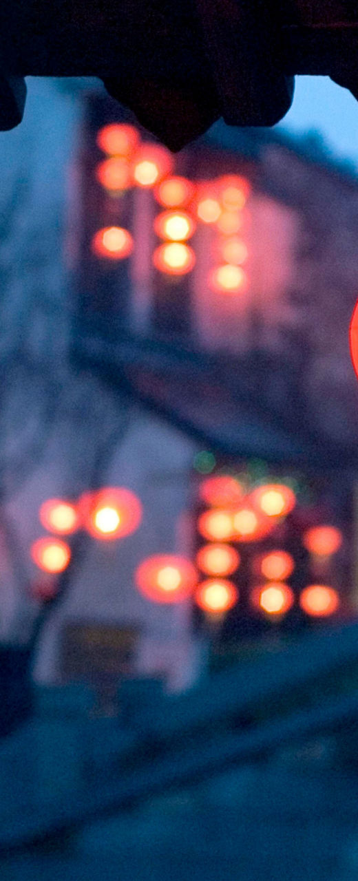 Traditional red lanterns in serene riverside town