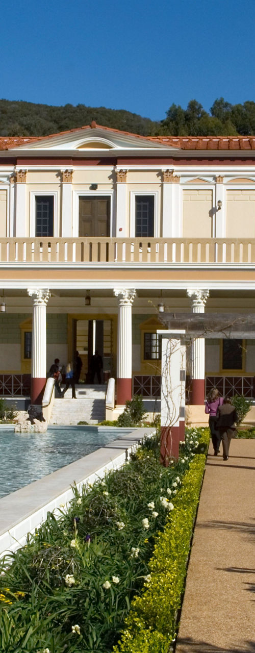 Elegant villa with reflecting pool and gardens