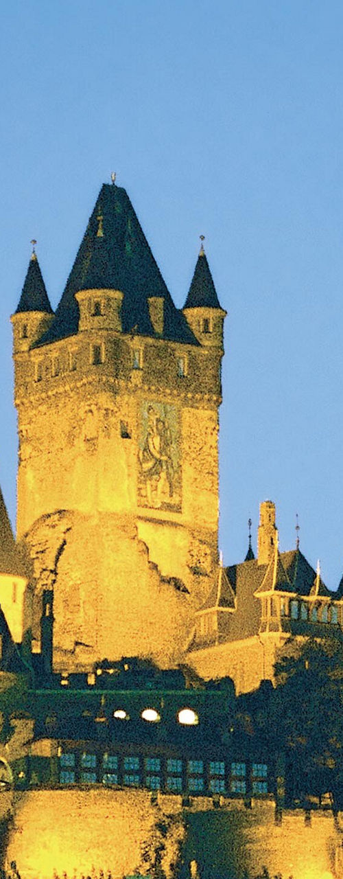 Illuminated medieval castle at dusk