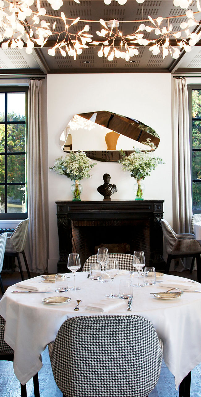 Elegant restaurant dining room with chandeliers