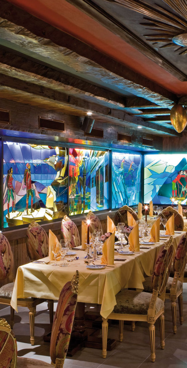 Elegant restaurant with colorful stained glass decor