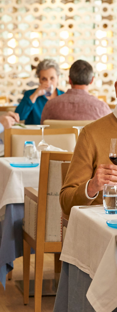 Elegant Restaurant Dining with Mature Guests Socializing