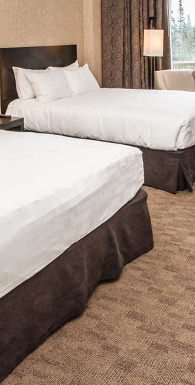 Modern hotel room with two queen beds