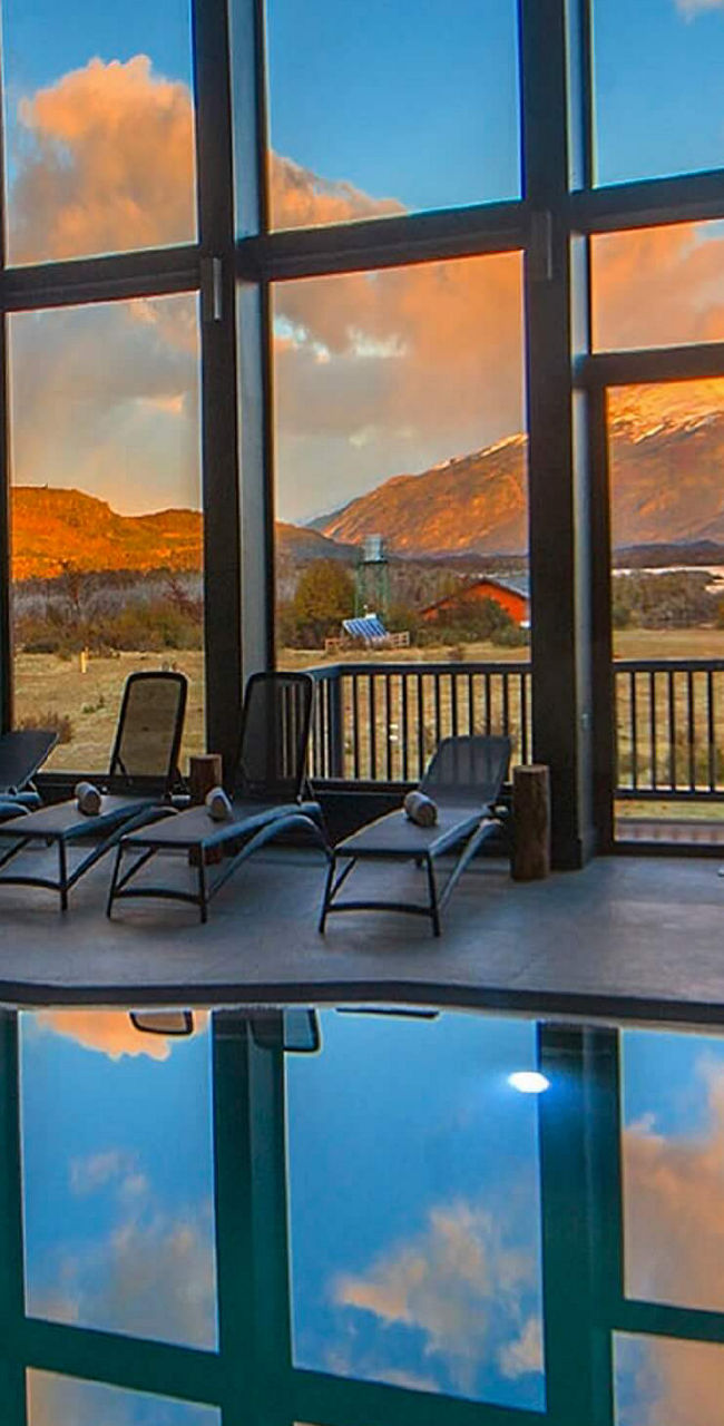 Indoor pool with mountain sunset view
