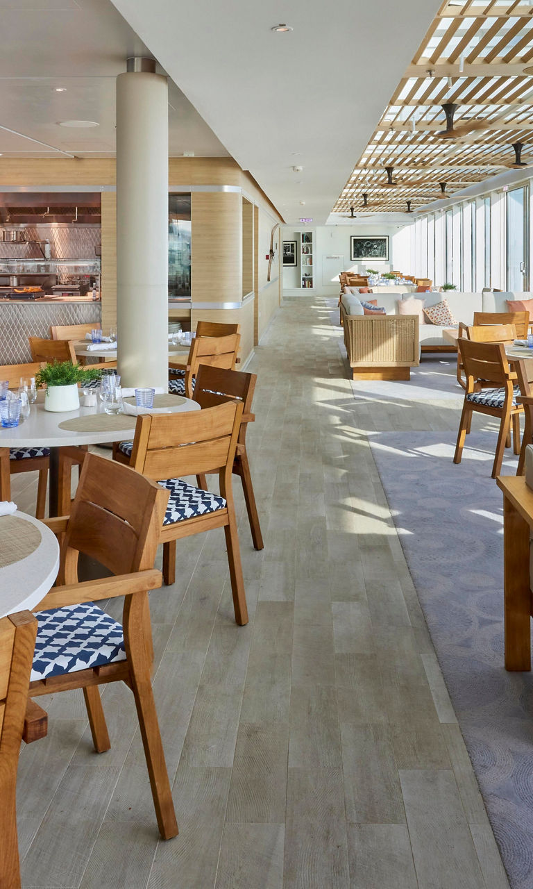 Modern riverside dining area with natural light