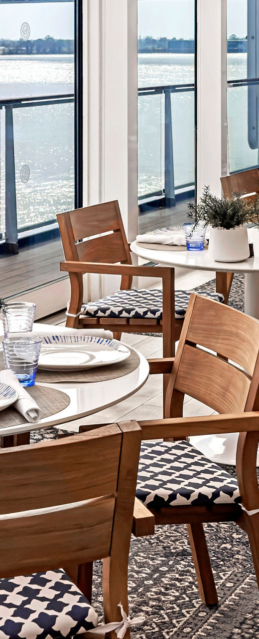 Modern riverside dining area with natural light