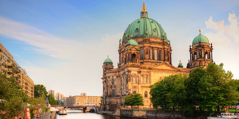 Berlin Cathedral by riverside at sunset