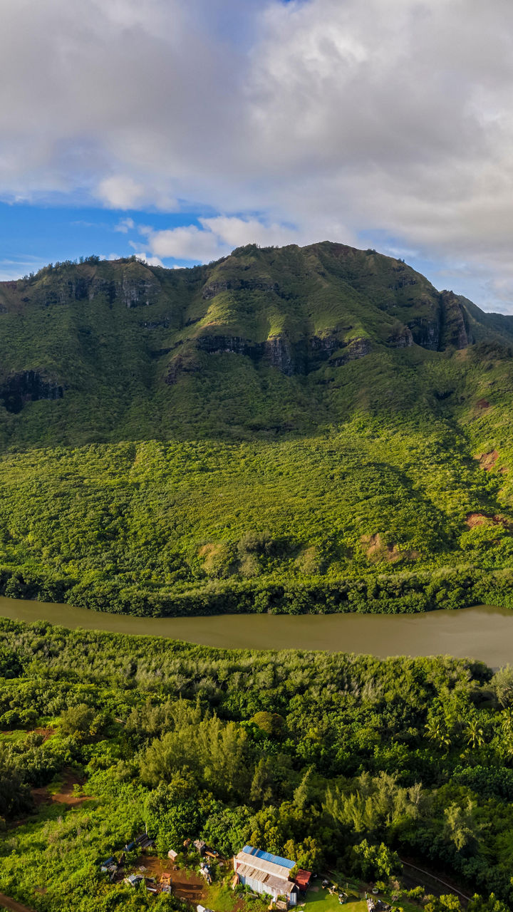 Aerial view of lush green valley and river