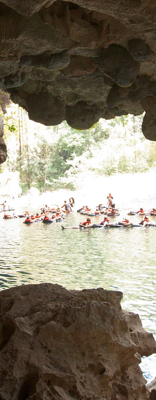 Group tubing adventure in scenic cave river