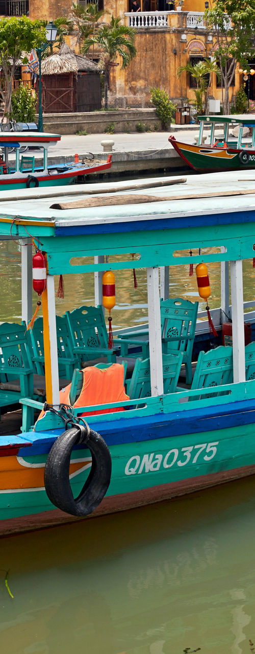 Colorful boat on Hoi An riverfront