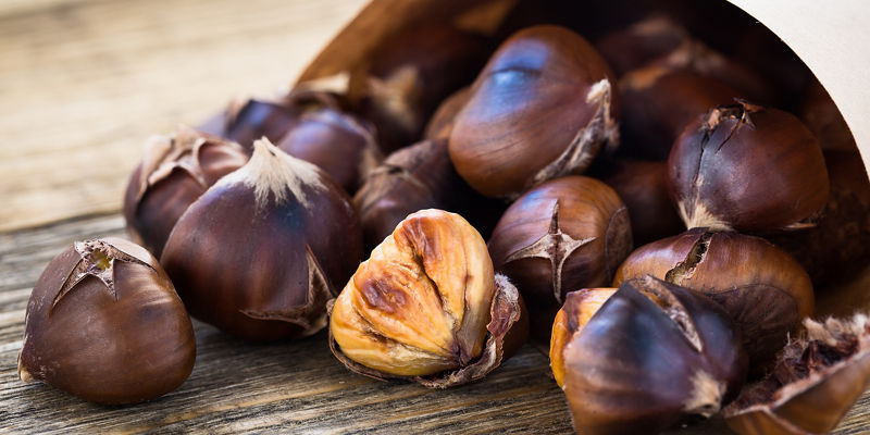 Fresh roasted chestnuts in paper bag