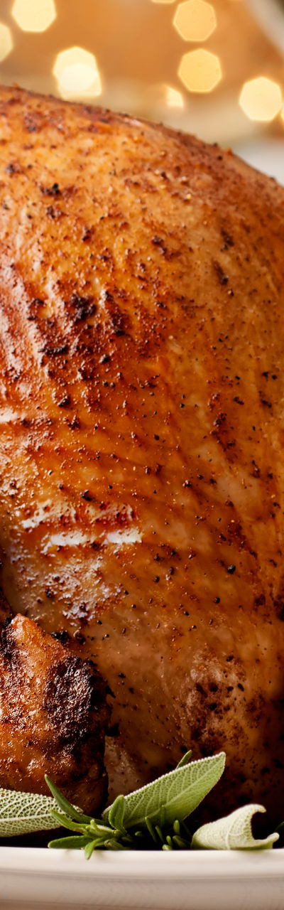 Golden roasted turkey with festive table setting