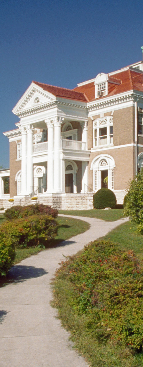 Elegant mansion with landscaped driveway