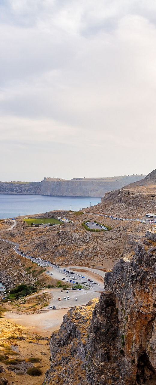Ancient ruins overlooking a coastal landscape