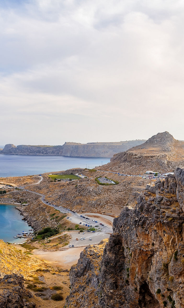 Ancient ruins overlooking a coastal landscape