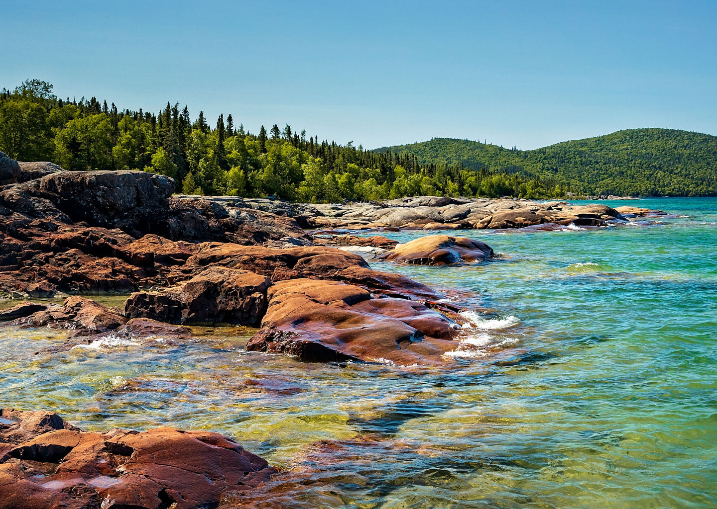 Rocky shoreline with clear blue water